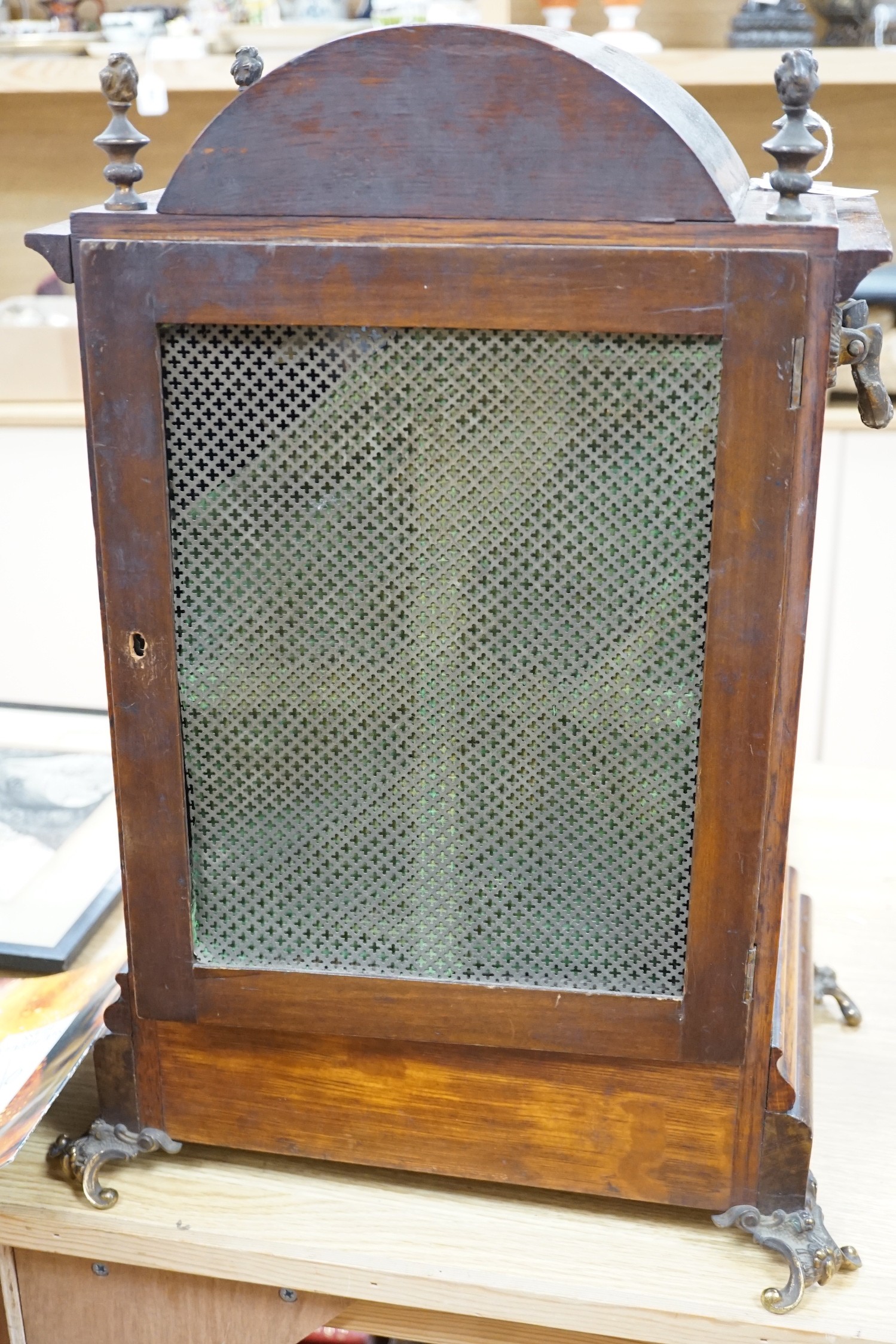 A late Victorian oak bracket clock with brass mounts and chiming movement, 55cms high